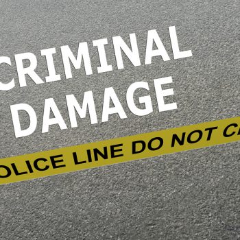 3D illustration of CRIMINAL DAMAGE title on the ground in a police arena. Police concept